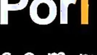 A man takes pictures on his smartphone as a young brunette in clothes sucks his dick